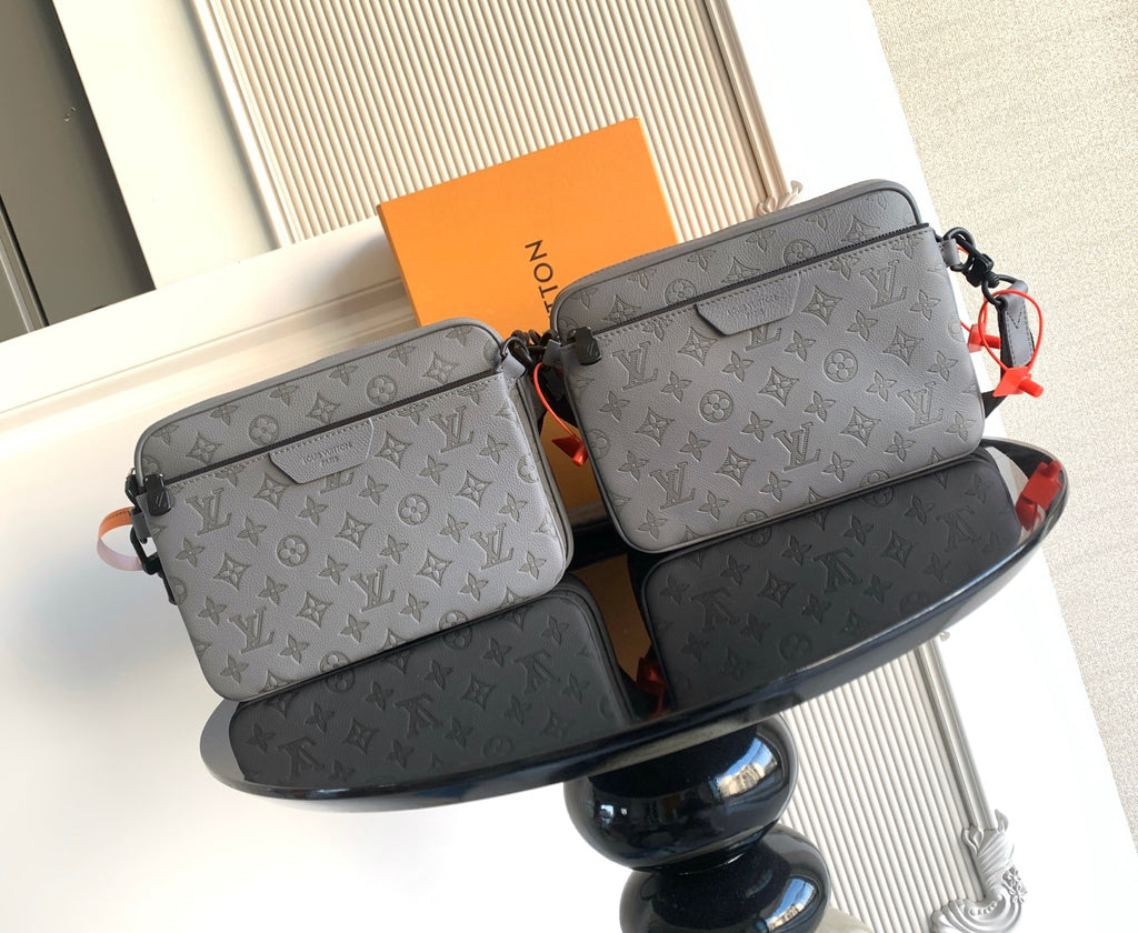 Louis Vuitton monogram crossbody bag, light gray with front flap and snap closure