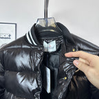 Moncler long puffer jacket neckline close-up, zip front, striped collar, tag