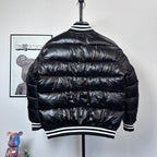 Moncler long puffer jacket, black, back view, striped ribbed hem and collar