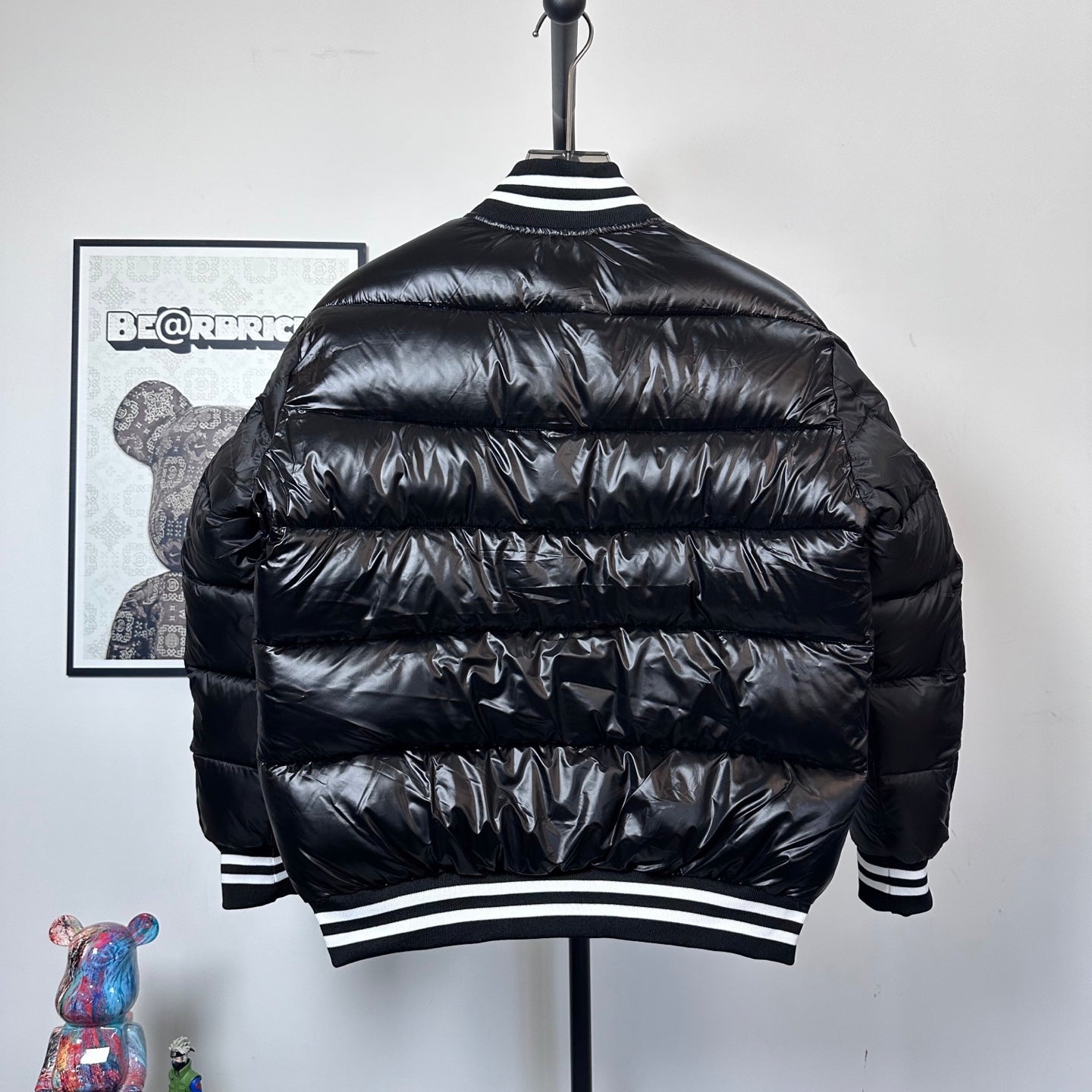 Moncler long puffer jacket, black, back view, striped ribbed hem and collar