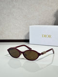 Dior sunglasses with burgundy frame and oval lenses, gold bridge detail.