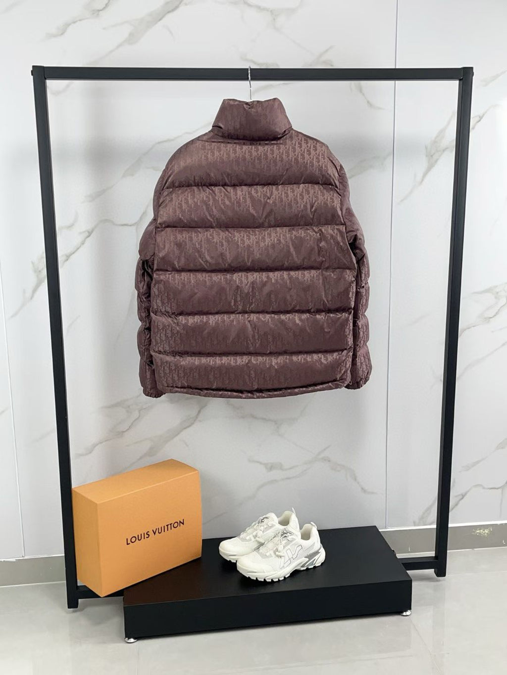 Mauve puffer jacket back view with quilted horizontal stripes