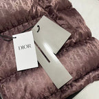 Mauve Dior monogram puffer jacket with zipped front and attached hang tags