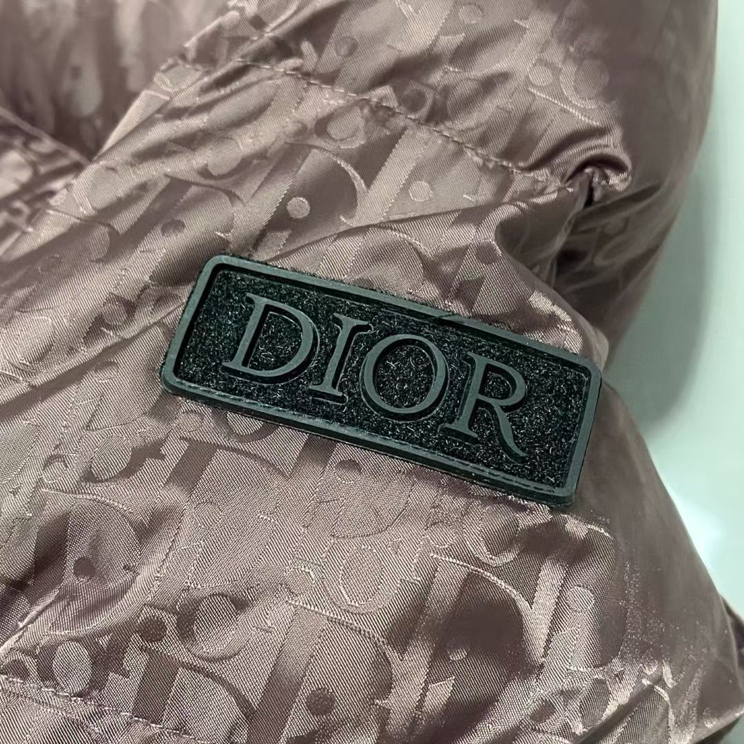 Dior logo patch on mauve puffer jacket sleeve