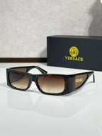 Versace sunglasses with black frame and dark brown-tinted lenses