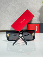 Black oversized square sunglasses with angular temples, Prada logo detail