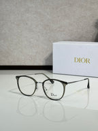 Dior eyeglasses with dark green round frames and clear lenses, logo at front