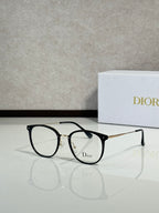Dior eyeglasses with black round frames and clear lenses, thin metal temples