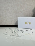 Clear metal round eyeglasses with silver-tone frame and Dior logo on lens