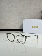 Smoke-tinted round eyeglasses with dark frame and Dior logo on lens