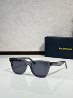 Balenciaga sunglasses with black frame and dark gray lenses