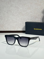 Balenciaga sunglasses with black frame and dark lenses