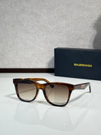 Balenciaga sunglasses with dark tortoise frame and brown lenses