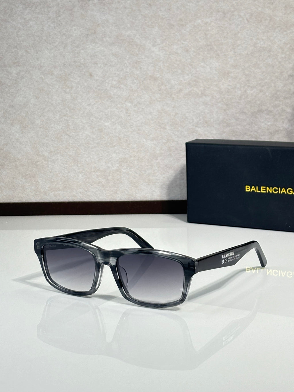 Balenciaga oversized square sunglasses with dark frame and smoked lenses
