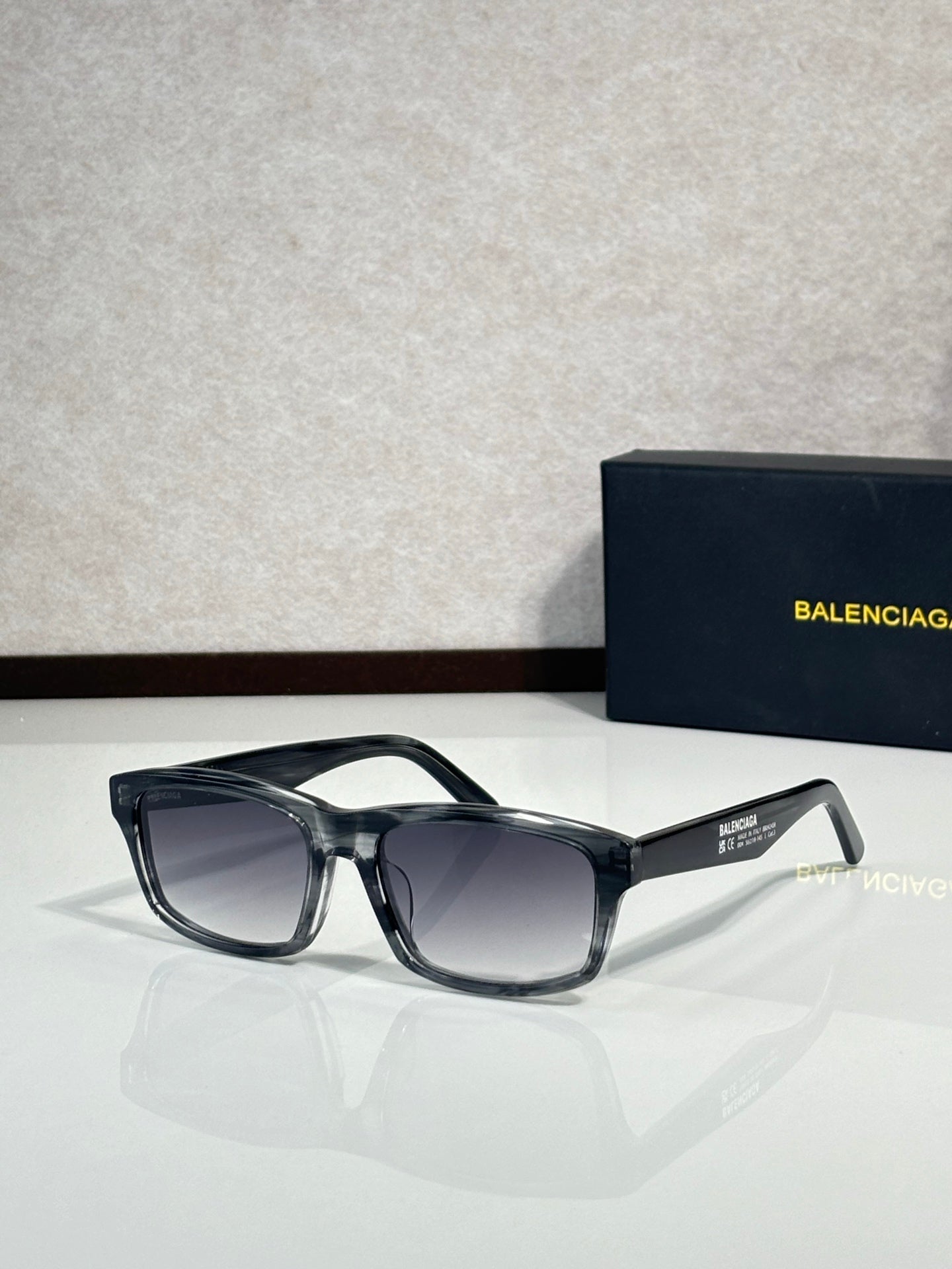 Balenciaga oversized square sunglasses with dark frame and smoked lenses