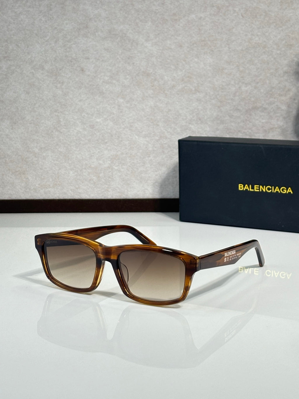 Balenciaga oversized square sunglasses with amber tortoiseshell frame and brown lenses