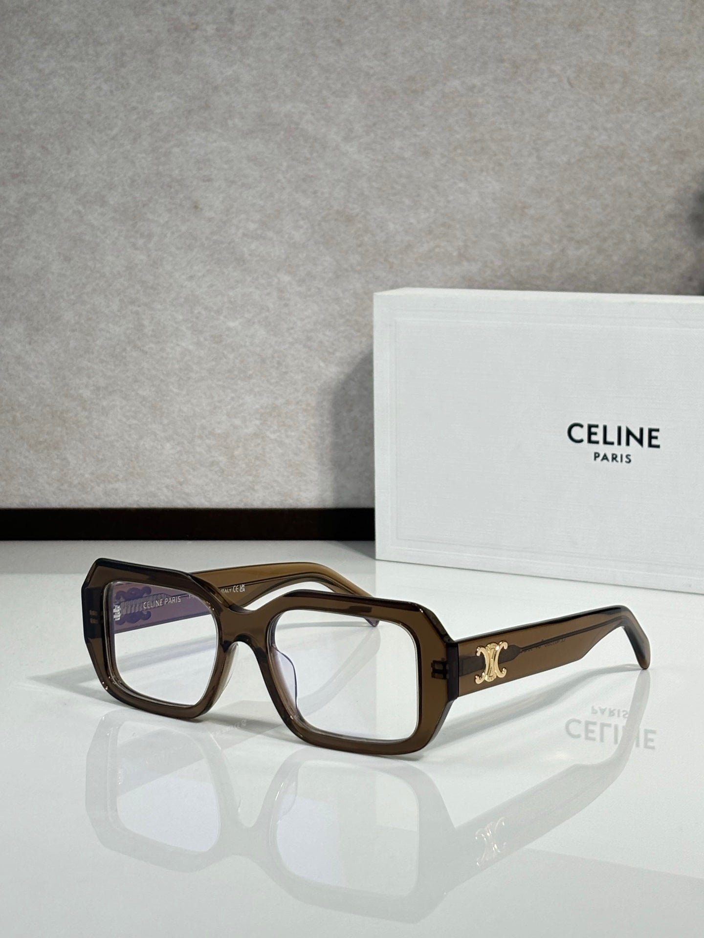 Celine tortoiseshell square eyeglasses with gold logo on temple.