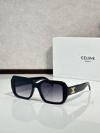 Celine black square sunglasses with gold logo on temple.