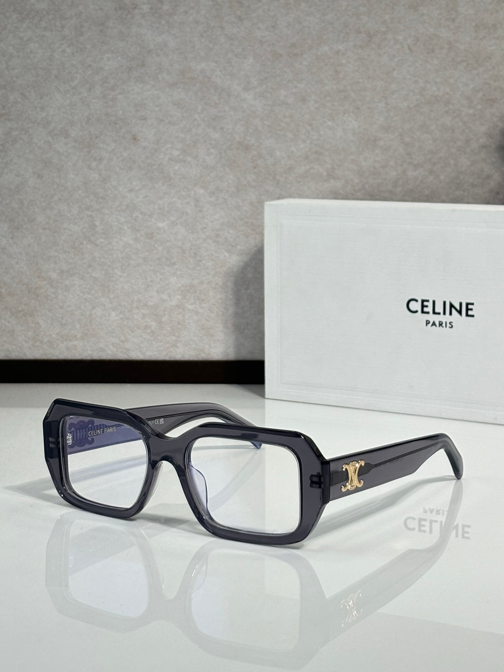 Celine black rectangular glasses with clear blue lenses and gold logo temple hardware
