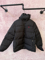 Black hooded puffer jacket with full-zip front and two zip chest pockets