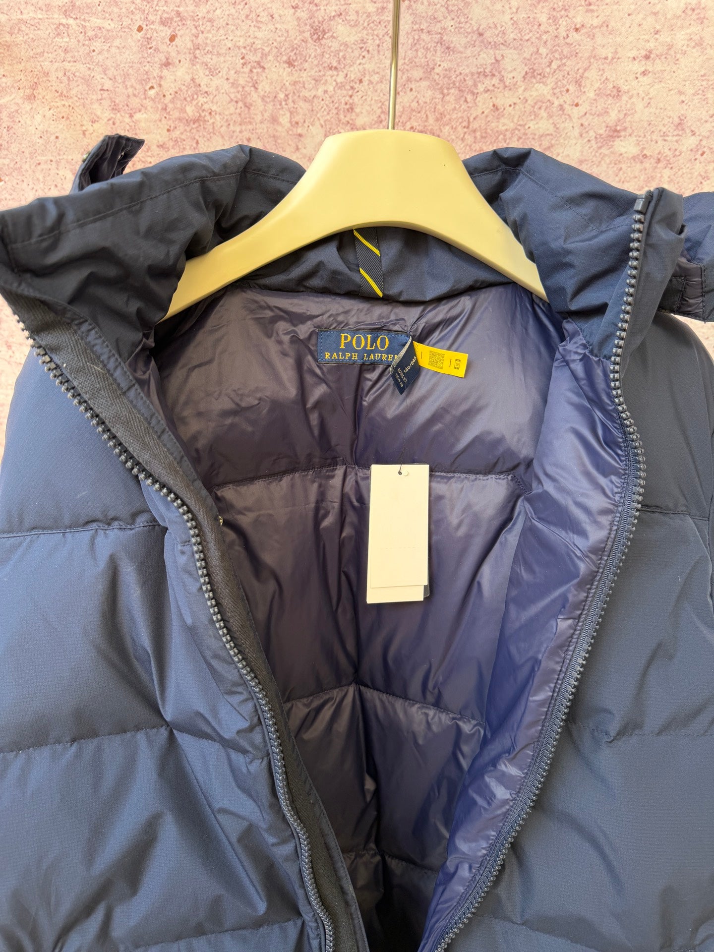 Navy puffer jacket lining with yellow collar and Polo Ralph Lauren logo label