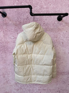 White hooded puffer jacket with full-zip front and padded quilted panels