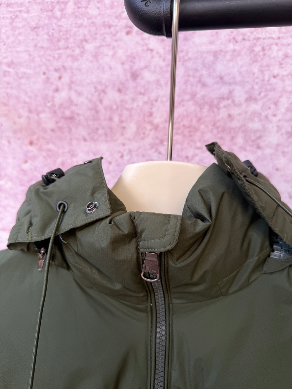Olive green puffer jacket with hood and front zipper