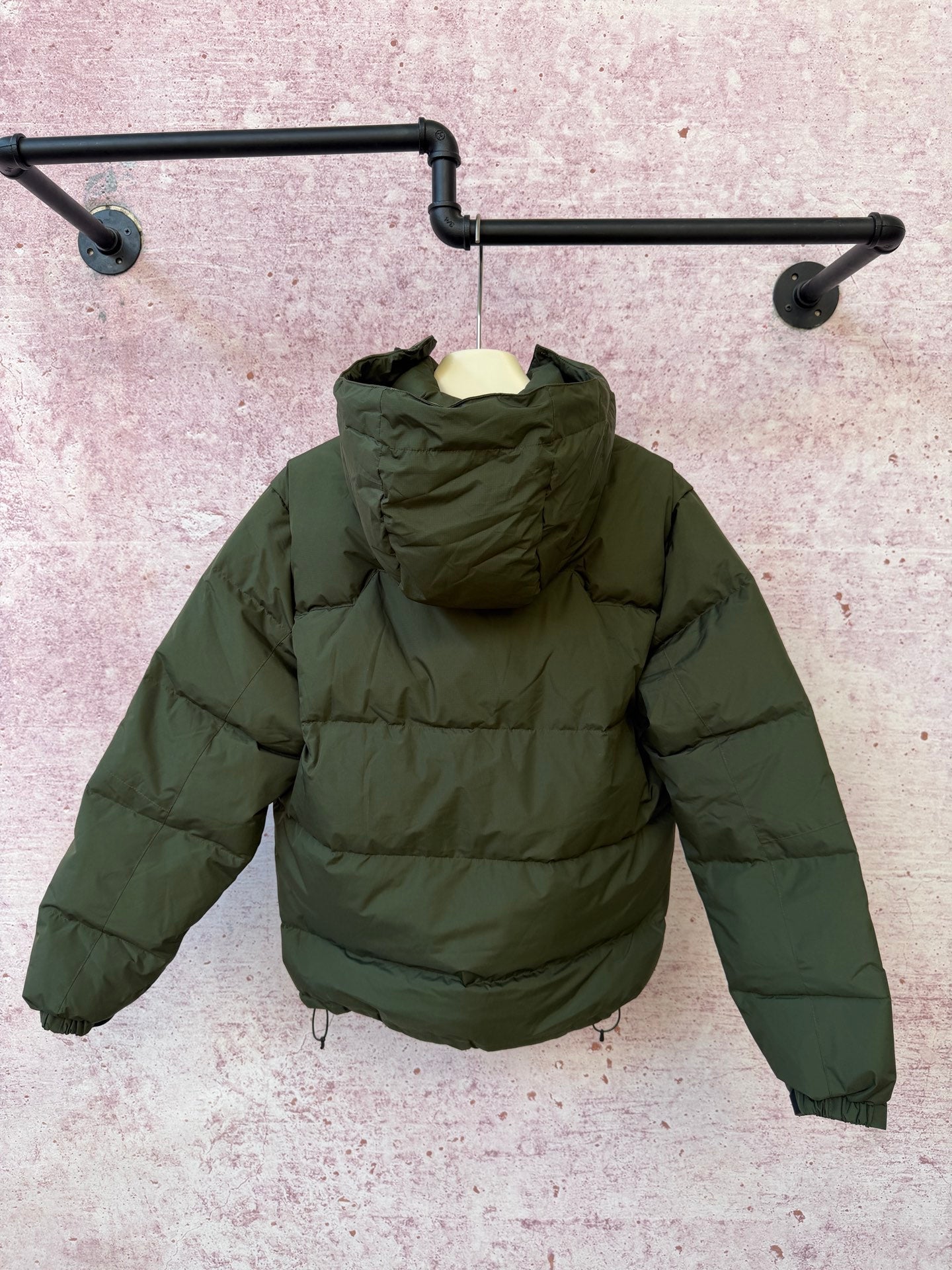 Olive green hooded puffer jacket, full-zip front with drawstring hem