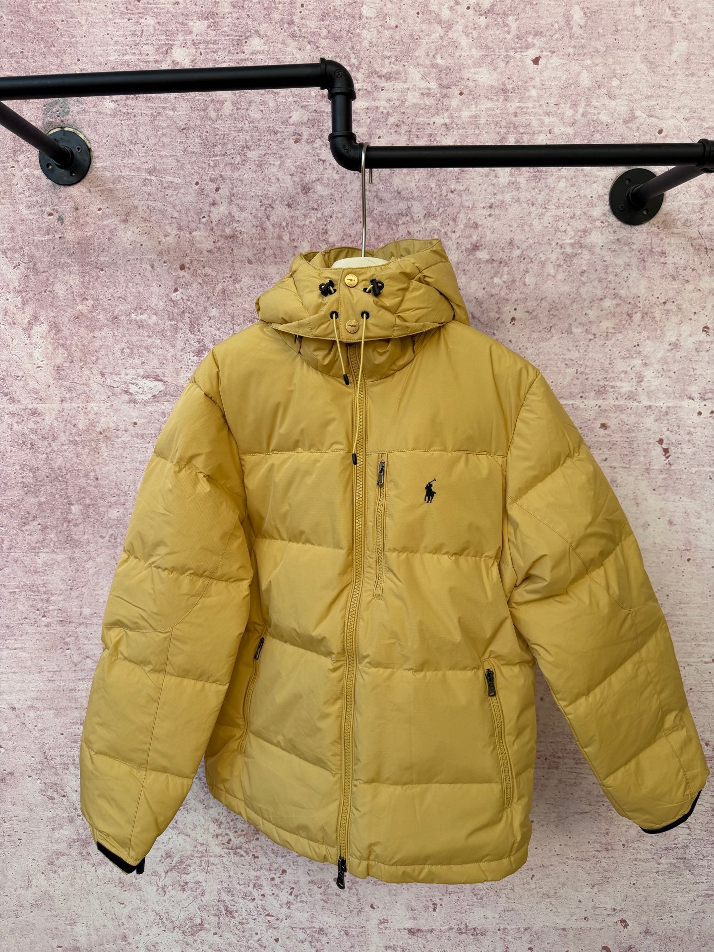 Yellow hooded puffer jacket with full-zip front and zip side pockets