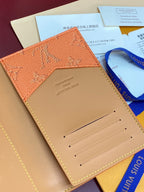 Louis Vuitton monogram leather cardholder with card slots, orange flap and beige lining