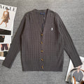 Dark gray cable-knit cardigan sweater with V-neck and gold button placket