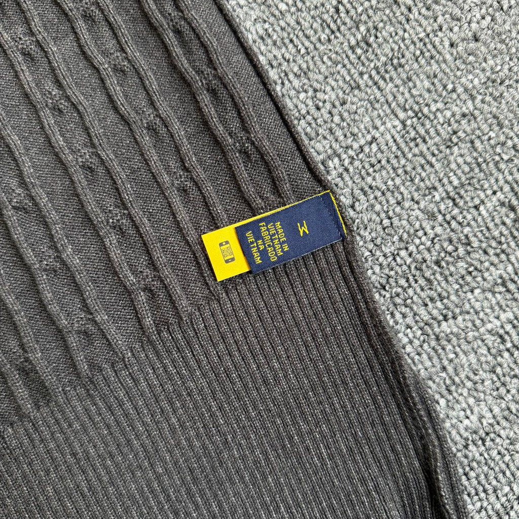 Dark gray knit cardigan label detail with Polo Ralph Lauren brand tab