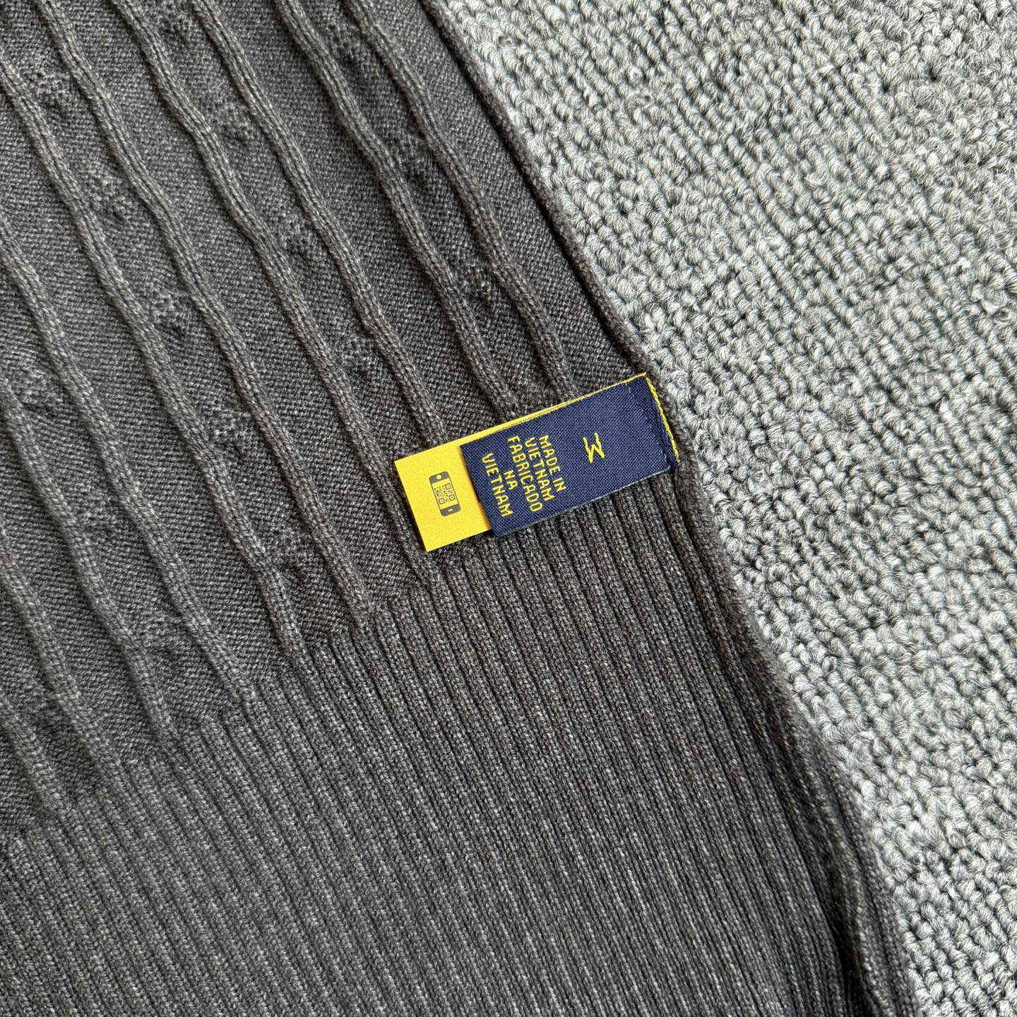 Dark gray knit cardigan label detail with Polo Ralph Lauren brand tab