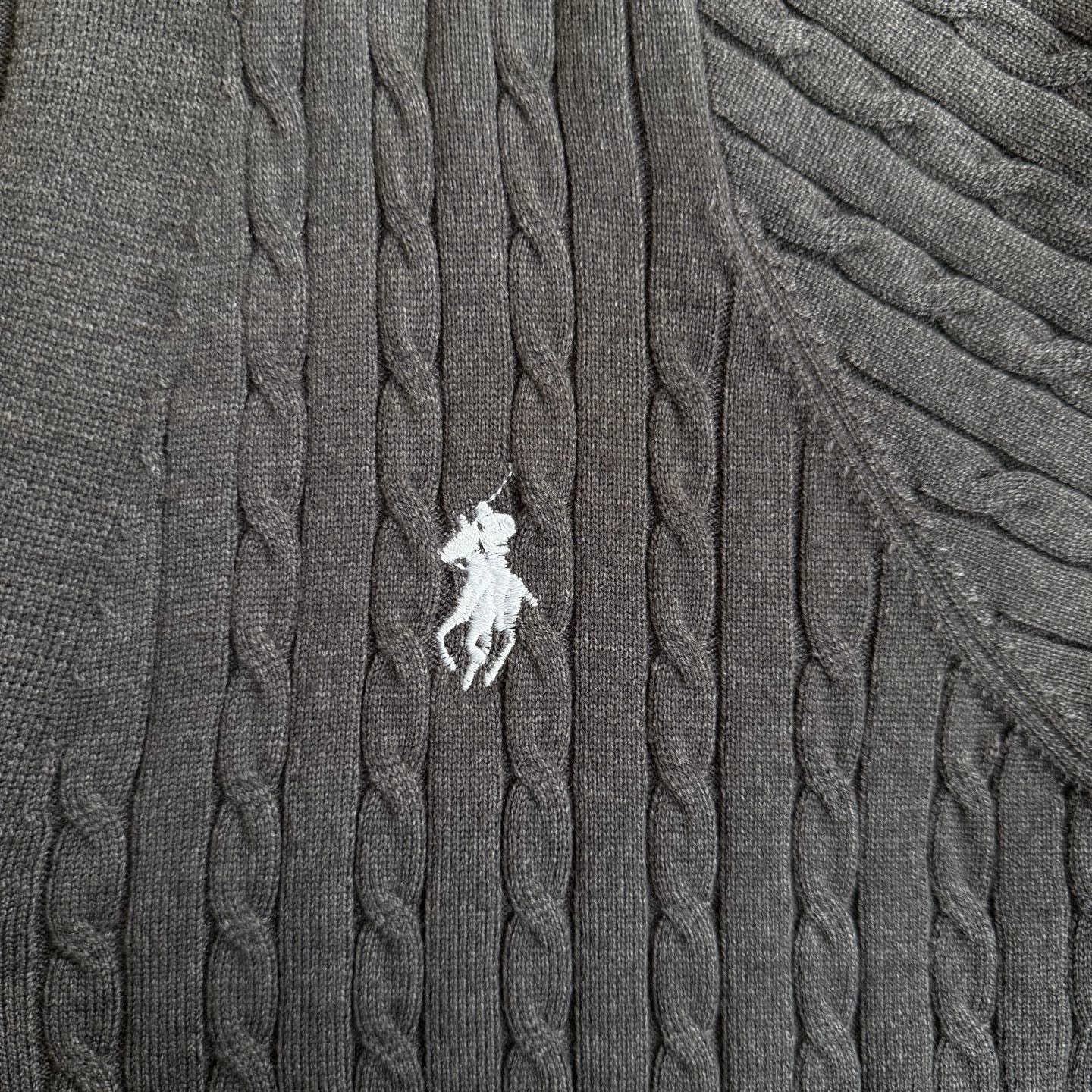 Dark gray cable-knit cardigan with white Polo horse logo on the chest