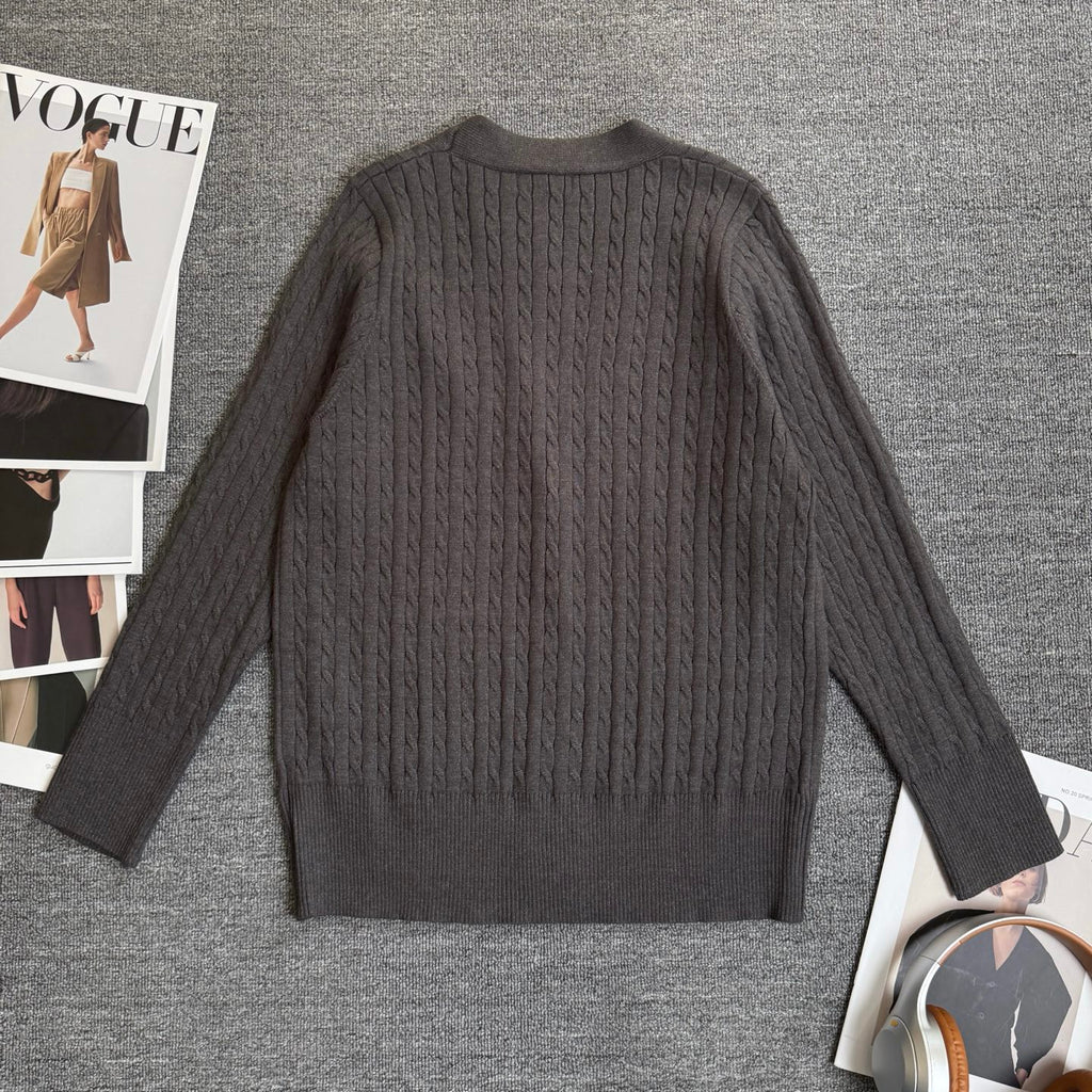 Dark gray cable-knit cardigan back view with ribbed collar and cuff
