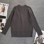 Dark gray cable-knit cardigan back view with ribbed collar and cuff