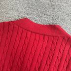 Red cable-knit cardigan ribbed crew collar and neckline texture