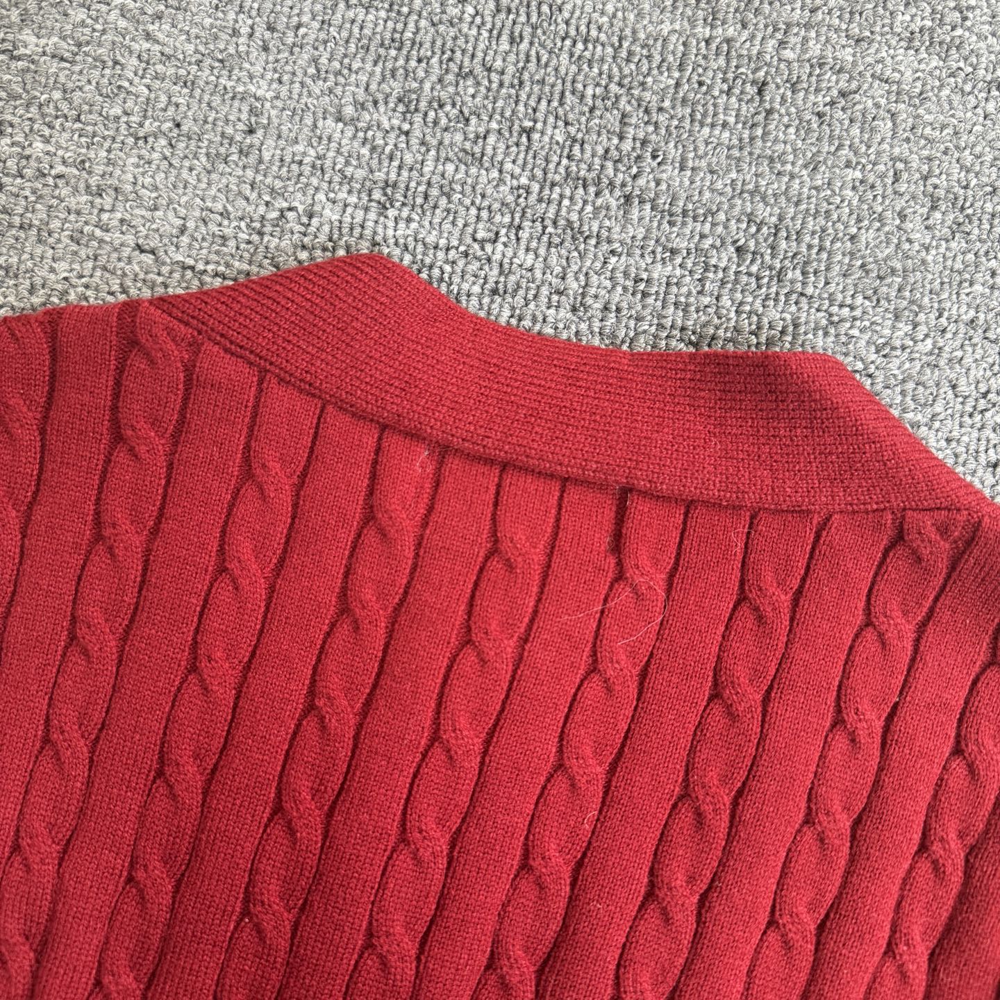 Red cable-knit cardigan ribbed crew collar and neckline texture