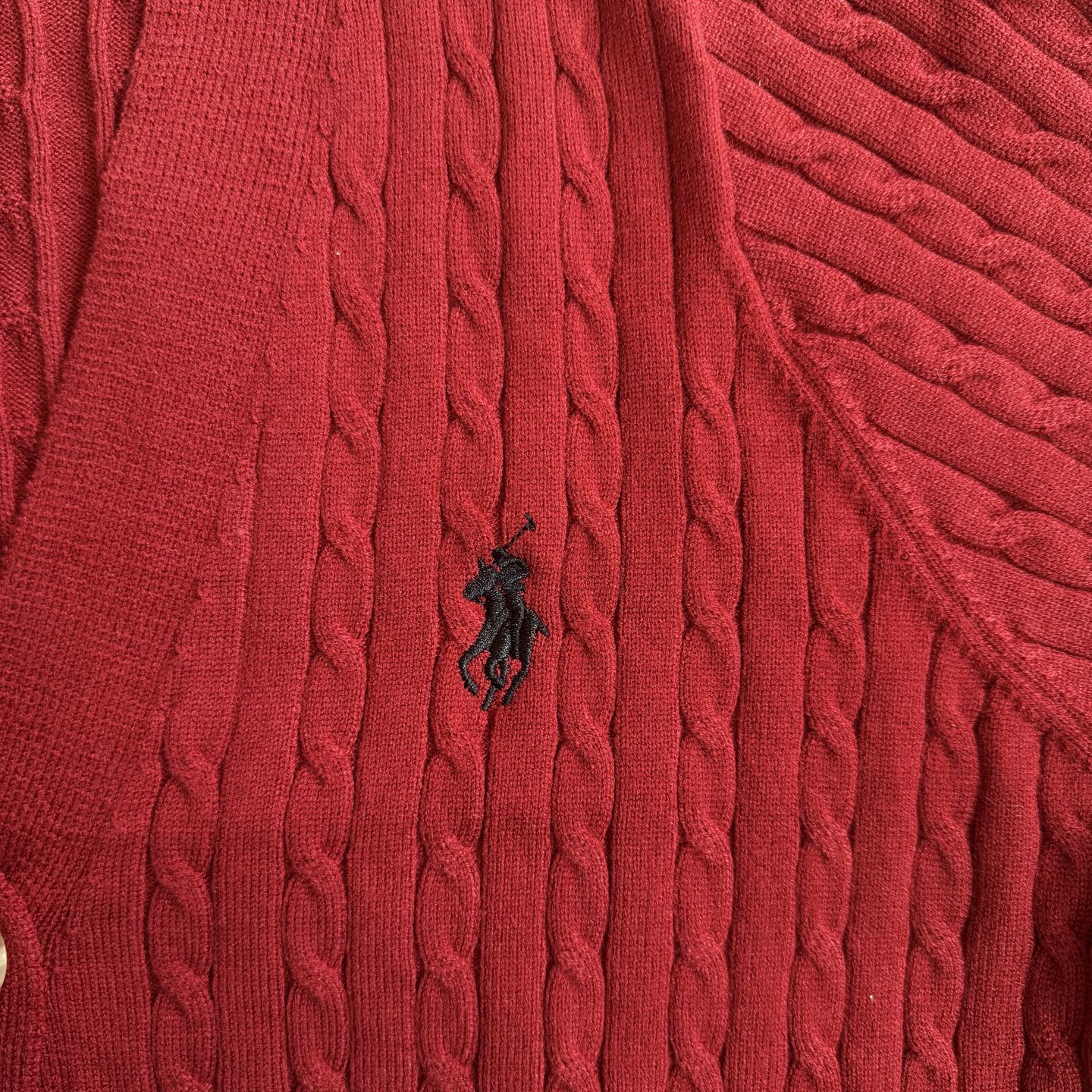 Red cable-knit cardigan with small Polo horse logo at chest