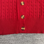 Red cable-knit cardigan front with gold tone button details