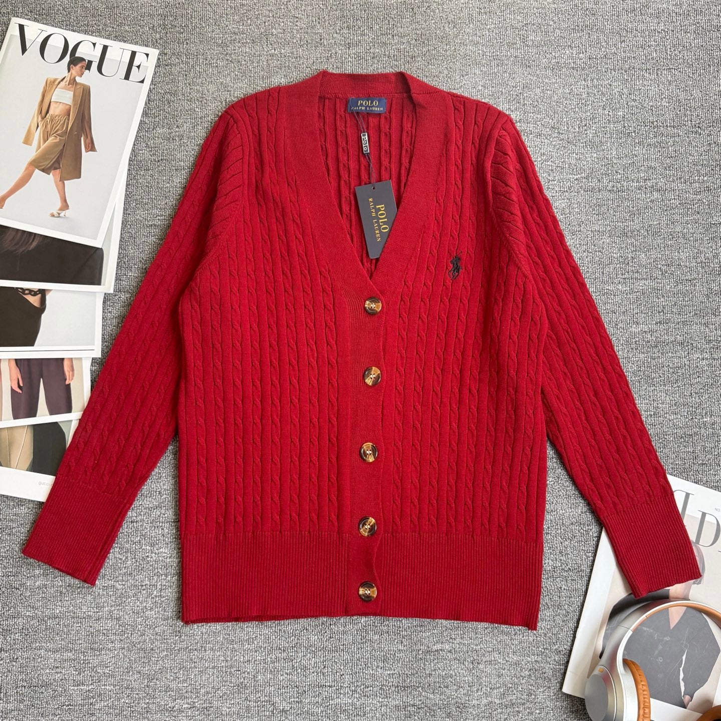 Red cable-knit cardigan with V-neck and button front
