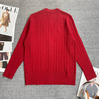 Red cable-knit cardigan back view with long sleeves