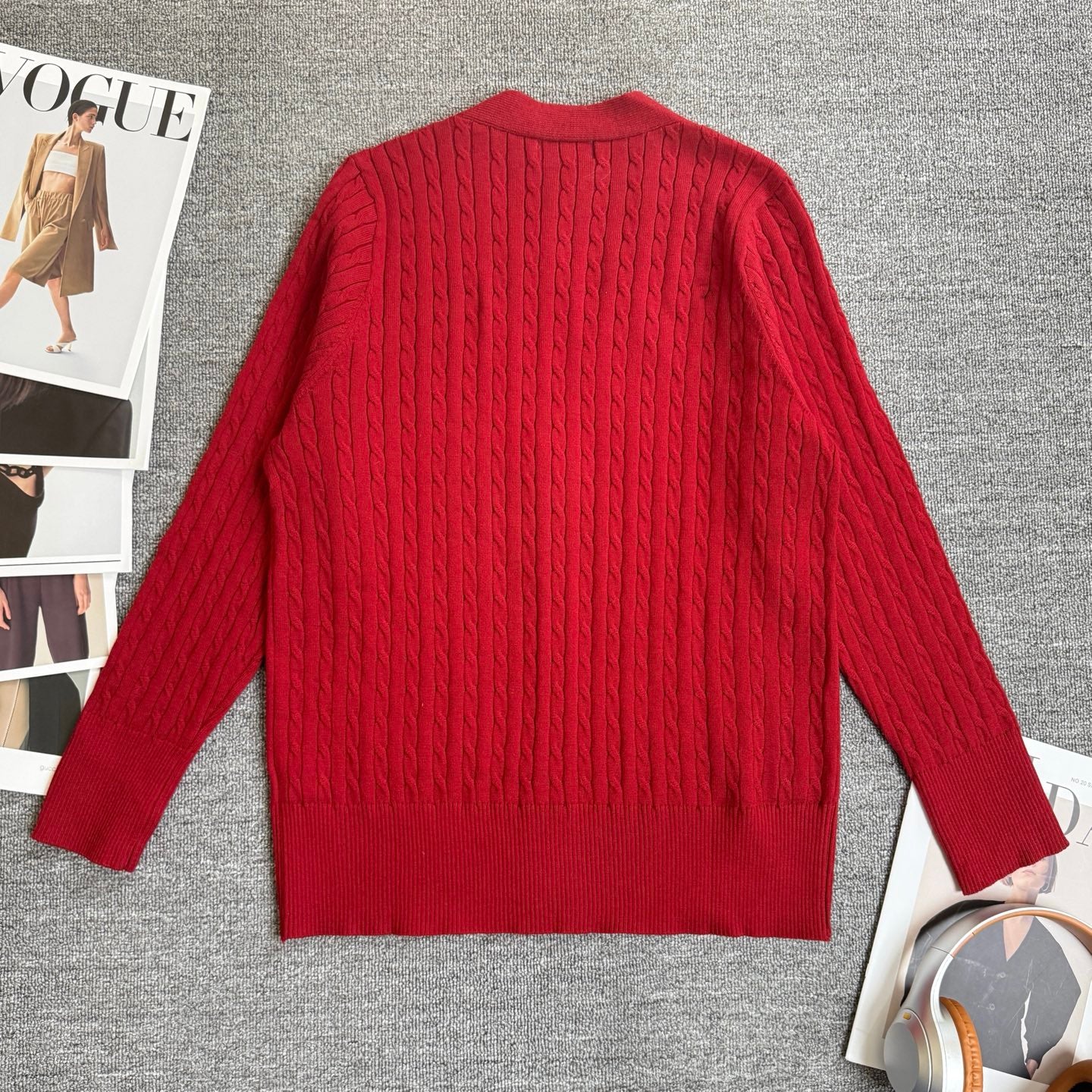 Red cable-knit cardigan back view with long sleeves