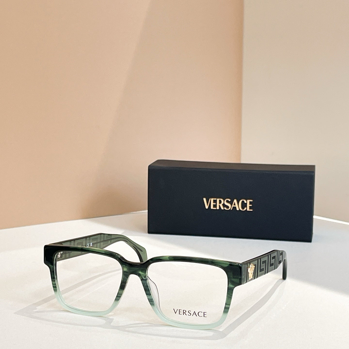 Versace eyeglasses, light green square frames, logo temple detail