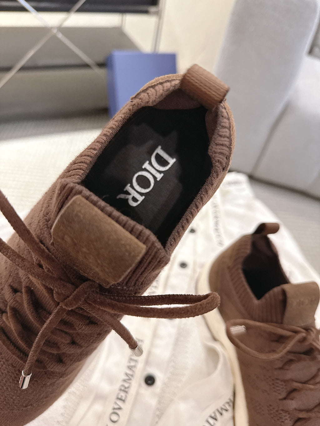 Dior unisex sneaker interior lining and lace-up opening in brown and black