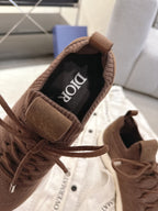 Dior unisex sneaker interior lining and lace-up opening in brown and black