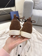 Dior unisex brown sneakers with lace-up front and white heel and outsole branding