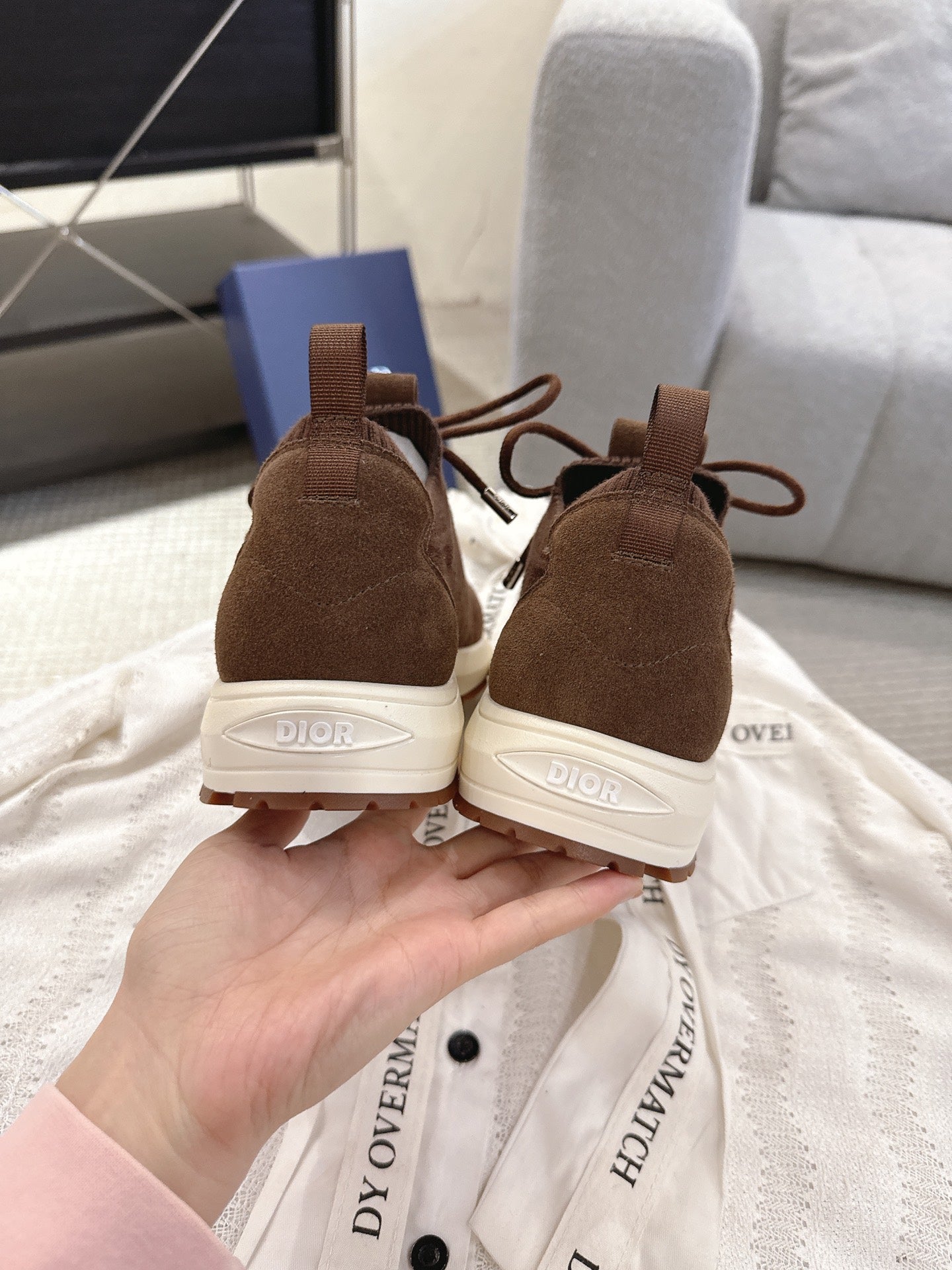 Dior unisex brown sneakers with lace-up front and white heel and outsole branding