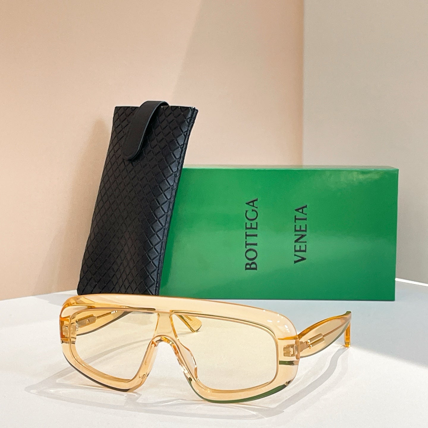 Bottega Veneta sunglasses with gold frame and clear lenses, with black case