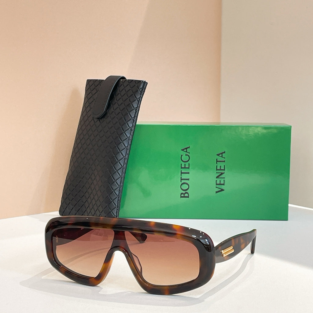 Bottega Veneta sunglasses with dark tortoiseshell frame and warm brown lenses, black case